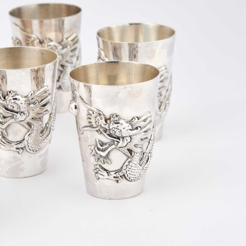 164 - A CHINESE SILVER COCKTAIL SHAKER AND SIX CUPS each with two marks and chased with dragons chasing a ... 