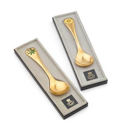 178 - GEORG JENSEN: TWO DANISH STERLING SILVER-GILT AND ENAMEL SPOONS by Georg Jensen, each handle dated t... 