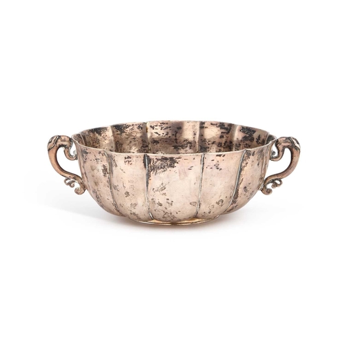 179 - AN 18TH CENTURY SPANISH COLONIAL SILVER TWO-HANDLED BOWL Guatemala, c.1770, the fluted circular body... 