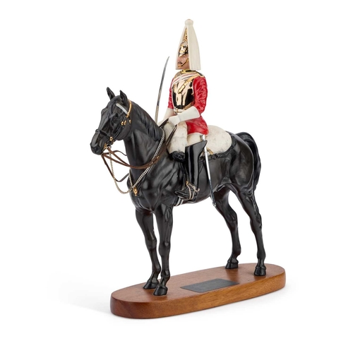 24 - A BESWICK MODEL OF A 'LIFE GUARD' Connoisseur Model, on a wooden plinth. 36.5cm high