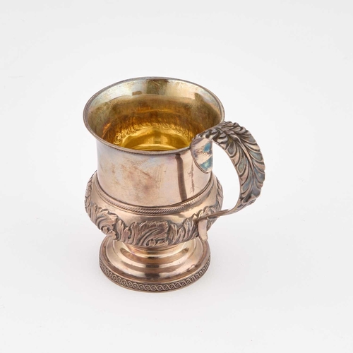 278 - A GEORGE IV SILVER MUG by Solomon Hougham, London 1821, chased with acanthus leaves, the strap handl... 