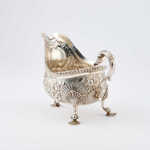 283 - A LARGE VICTORIAN SILVER SAUCEBOAT by Charles Stuart Harris, London 1890, the C-scroll handle with a... 