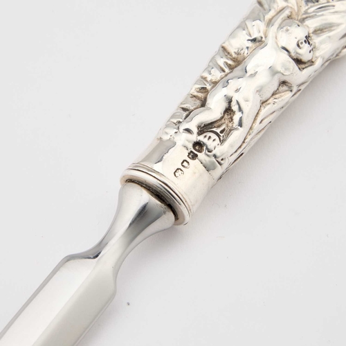 292 - A VICTORIAN SILVER-HANDLED LETTER OPENER by William Comyns & Sons, London 1887, with a figural h... 