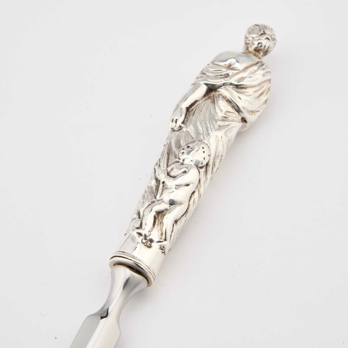 292 - A VICTORIAN SILVER-HANDLED LETTER OPENER by William Comyns & Sons, London 1887, with a figural h... 