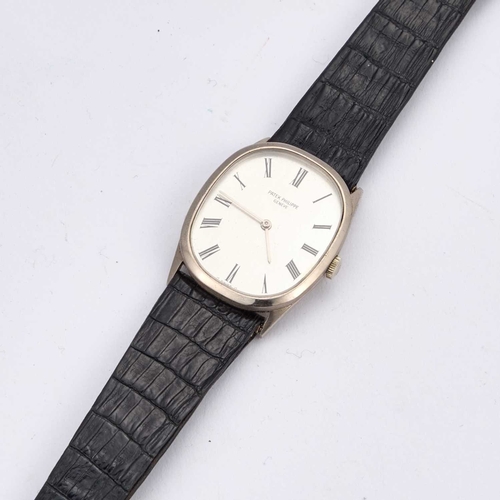 372 - A GENTS 18CT WHITE GOLD PATEK PHILIPPE ELLIPSE STRAP WATCH the elliptical textured silvered dial sig... 