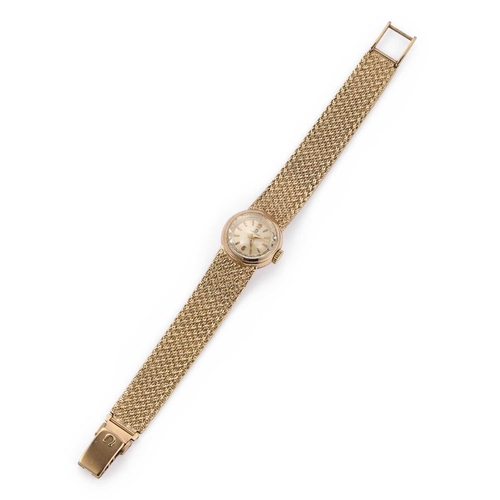 375 - A LADY'S 9CT GOLD OMEGA BRACELET WATCH the circular silvered dial signed Omega, with gilt baton indi... 