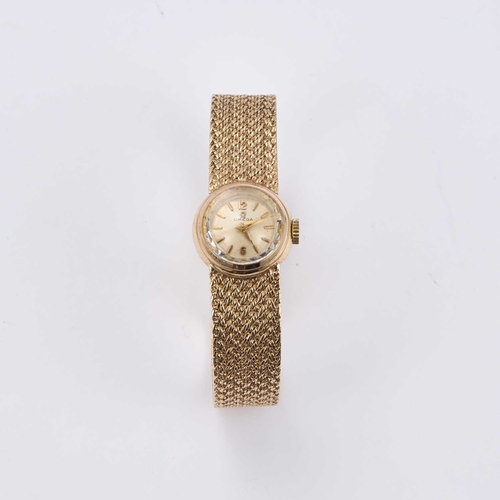 375 - A LADY'S 9CT GOLD OMEGA BRACELET WATCH the circular silvered dial signed Omega, with gilt baton indi... 