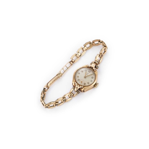 385 - A LADY'S 9CT GOLD TUDOR BRACELET WATCH the circular ivory dial signed Tudor with gilt Arabic indices... 