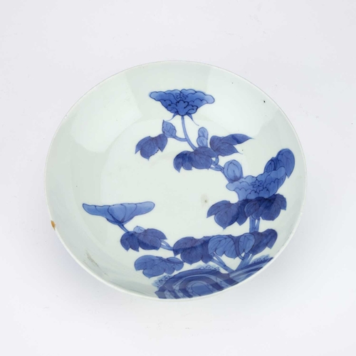 47 - A JAPANESE BLUE AND WHITE PORCELAIN FOOTED DISH circular with rounded sides, the bowl painted with f... 