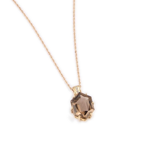 538 - A 9 CARAT GOLD SMOKY QUARTZ AND WHITE SAPPHIRE PENDANT ON CHAIN a hexagonal-cut smoky quartz to a ro... 