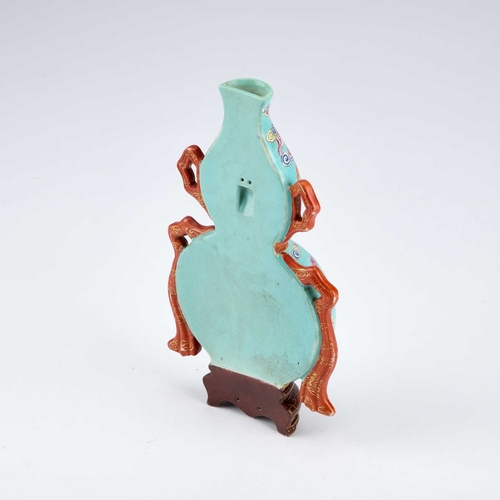 61 - A CHINESE TURQUOISE-GROUND FAMILLE ROSE WALL VASE the gourd-shaped vase modelled with trailing ribbo... 