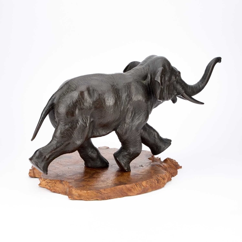 88 - A LARGE JAPANESE BRONZE MODEL OF AN ELEPHANT Meiji period (1868-1912), finely modelled in a running ... 