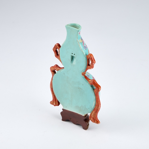 101 - A CHINESE TURQUOISE-GROUND FAMILLE ROSE WALL VASE the gourd-shaped vase modelled with trailing ribbo... 