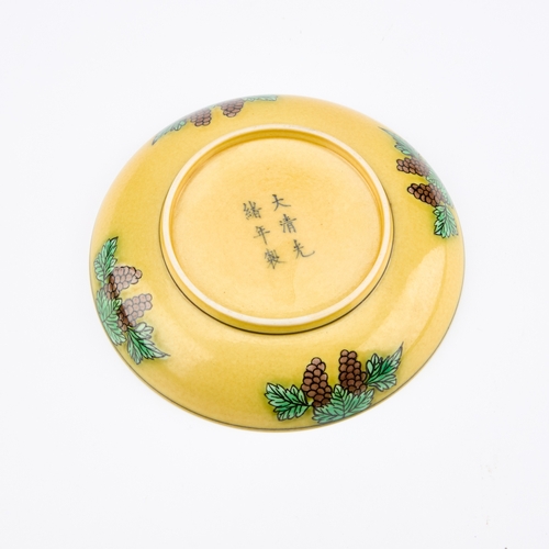 111 - A CHINESE YELLOW-GROUND 'DRAGON' DISH circular, painted with two dragons chasing a flaming pearl, be... 