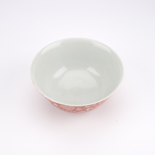 122 - A CHINESE PORCELAIN BOWL WITH AN IRON-RED GROUND circular with rounded sides and a circular foot, fi... 