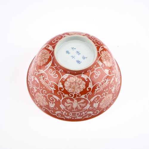 122 - A CHINESE PORCELAIN BOWL WITH AN IRON-RED GROUND circular with rounded sides and a circular foot, fi... 