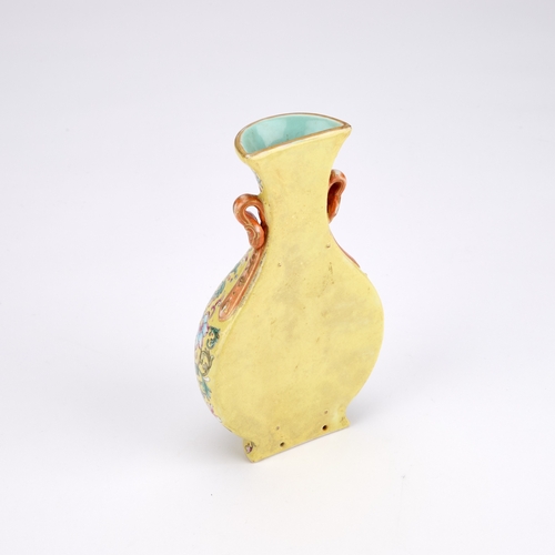 128 - A CHINESE FAMILLE ROSE WALL VASE WITH A YELLOW-GROUND of baluster form, the body finely decorated wi... 