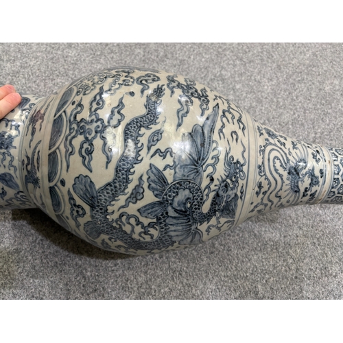 132 - A LARGE CHINESE YUAN-STYLE BLUE AND WHITE PEAR-SHAPED 'DRAGON' VASE decorated with dragons above cra... 