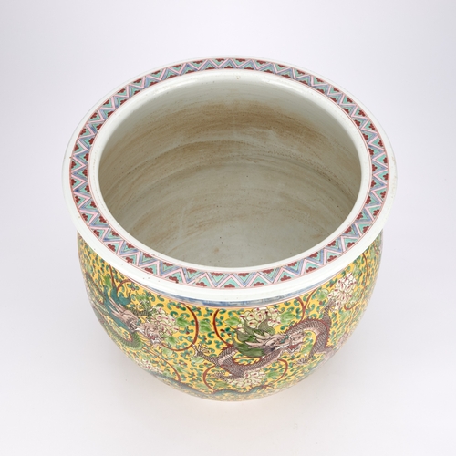 139 - A LARGE CHINESE YELLOW-GROUND PORCELAIN 'DRAGON' PLANTER circular with rounded sides, vibrantly enam... 