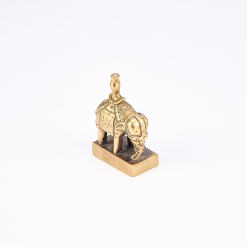 175 - A CHINESE BRONZE SEAL modelled in the form of a caparisoned elephant standing four square. 5.6cm hig... 