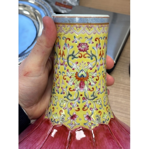 176 - A CHINESE FAMILLE ROSE 'LOTUS' BOTTLE VASE the lower body brightly enamelled with a double row of up... 