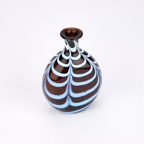 18 - A NAILSEA GLASS FLASK, 19TH CENTURY the brown glass body with white trailed decoration. 11.3cm high... 