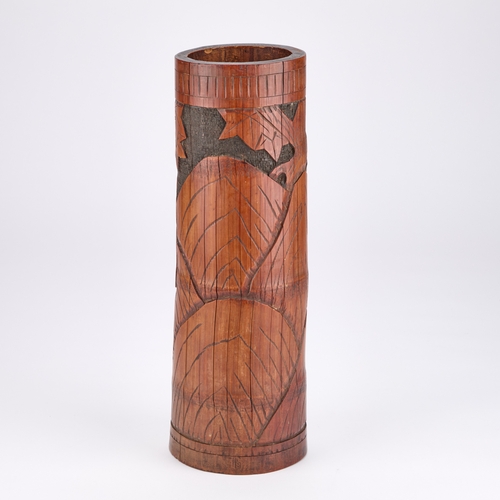 209 - A CHINESE BAMBOO BRUSH POT the tall cylindrical vessel carved with a figure. 40cm high