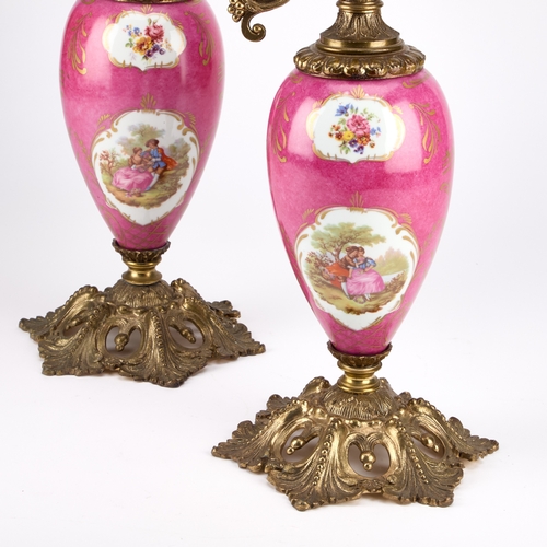 222 - A LARGE PAIR OF GILT-METAL MOUNTED PORCELAIN LAMP BASES each in the form of a ewer, the scroll-form ... 