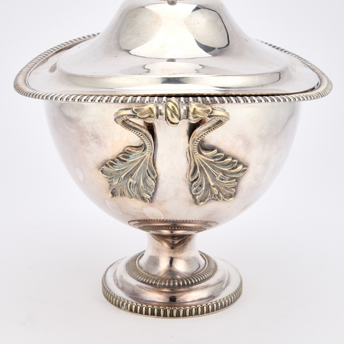 246 - A 19TH CENTURY SILVER-PLATED SOUP TUREEN oval with rounded sides and twin handles, the domed cover w... 