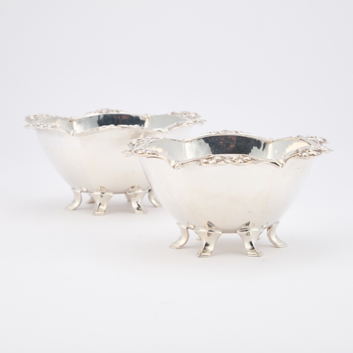 278 - A PAIR OF ARTS AND CRAFTS SILVER BOWLS by Omar Ramsden, London 1937, the lightly spot-hammered hexag... 