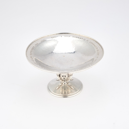 279 - AN ARTS AND CRAFTS SILVER TAZZA by Omar Ramsden, London 1928, the circular dish raised on a stem dec... 