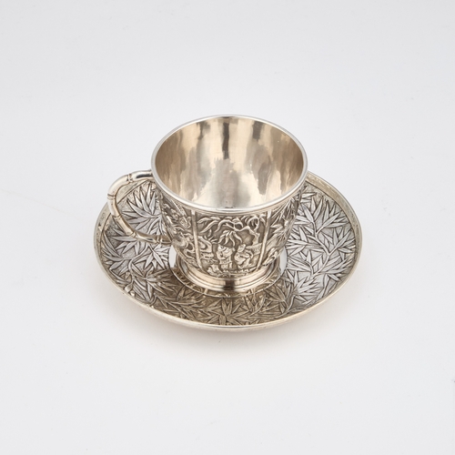 294 - A CHINESE SILVER CUP AND SAUCER mark of Wang Hing, c.1900, the double-skinned cup decorated in relie... 