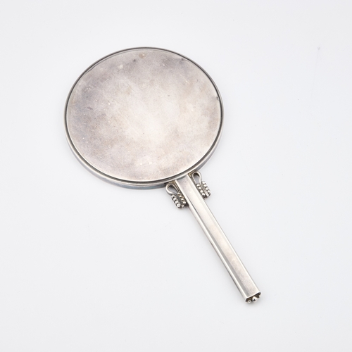 306 - HARALD NIELSEN FOR GEORG JENSEN, A DANISH STERLING SILVER HAND-MIRROR import marks, London 1957. 21.... 