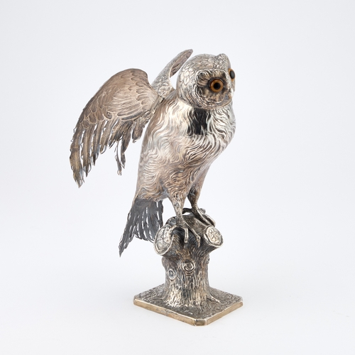 308 - A LARGE GERMAN SILVER MODEL OF AN OWL Hanau marks, late 19th Century, modelled perched on a tree stu... 