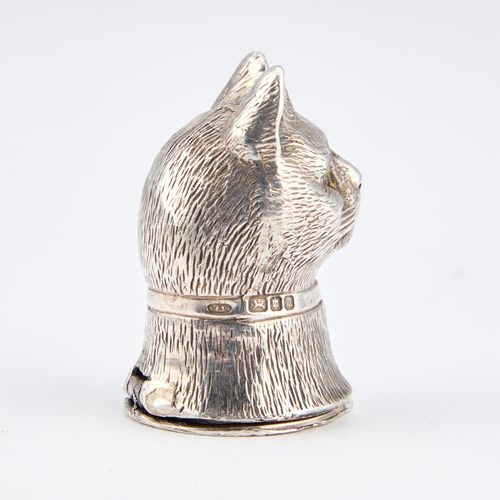 333 - AN ELIZABETH II SILVER NOVELTY VESTA CASE by B A C, London 1990, cast as the head of a cat. 3.7cm hi... 