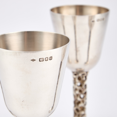 344 - A SET OF FOUR ELIZABETH II SILVER GOBLETS by Graham Watling, London 1975 and 1976, each with a bell-... 