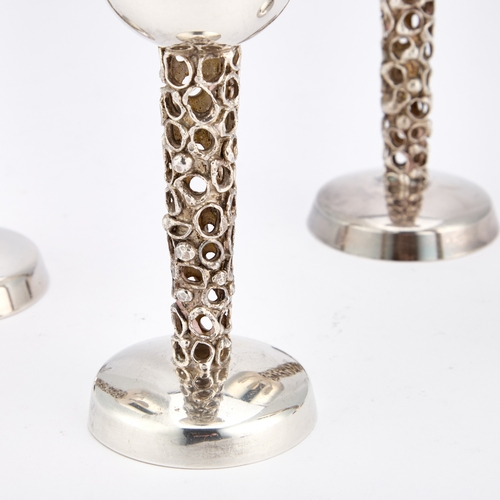 344 - A SET OF FOUR ELIZABETH II SILVER GOBLETS by Graham Watling, London 1975 and 1976, each with a bell-... 