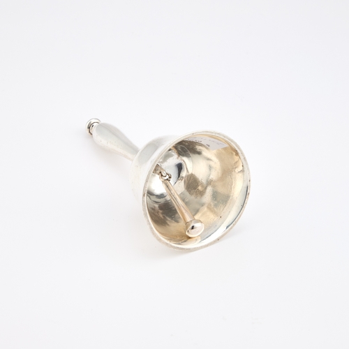 371 - A GEORGE V CAST SILVER TABLE BELL by Carrington & Co, London 1910, with a baluster handle. 12.5c... 