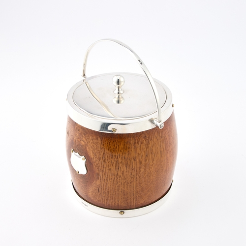 407 - A GEORGE V SILVER-MOUNTED OAK BISCUIT BARREL by Frank Cobb & Co Ltd, Sheffield 1924, with a swin... 