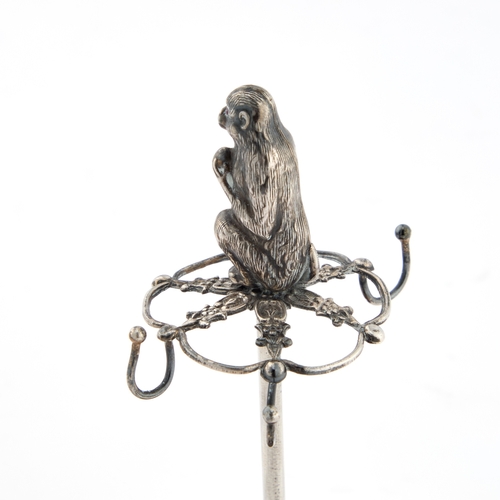 411 - AN EDWARDIAN NOVELTY HATPIN STAND by Arthur Johnson Smith, Birmingham 1909, surmounted by the figure... 