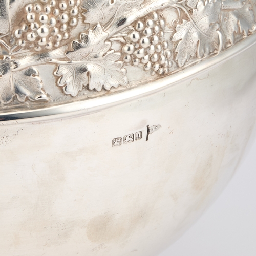 422 - A LATE VICTORIAN SILVER PUNCH BOWL by Walker and Hall, Sheffield 1899, the bowl with a chased fruiti... 