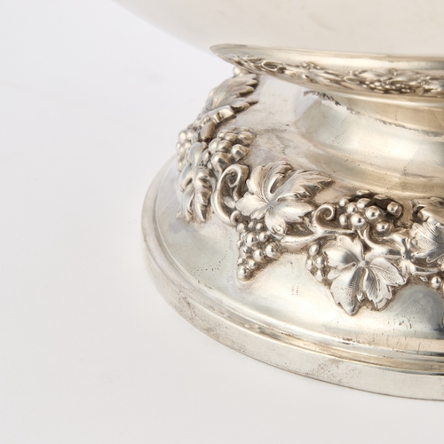 422 - A LATE VICTORIAN SILVER PUNCH BOWL by Walker and Hall, Sheffield 1899, the bowl with a chased fruiti... 