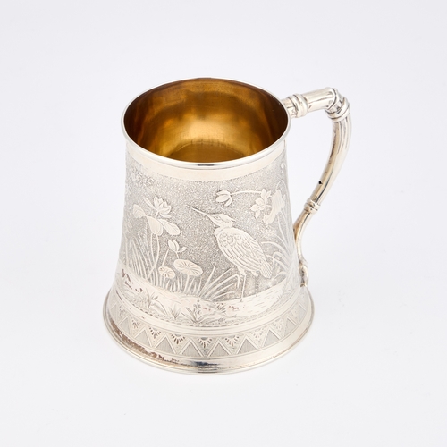 446 - AN AESTHETIC MOVEMENT SILVER MUG by Frederick Elkington, Birmingham 1879, the spreading circular bod... 