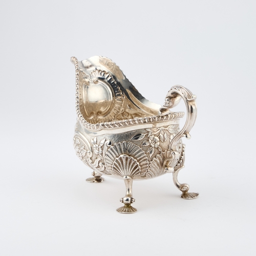 469 - A LARGE VICTORIAN SILVER SAUCEBOAT by Charles Stuart Harris, London 1890, the C-scroll handle with a... 