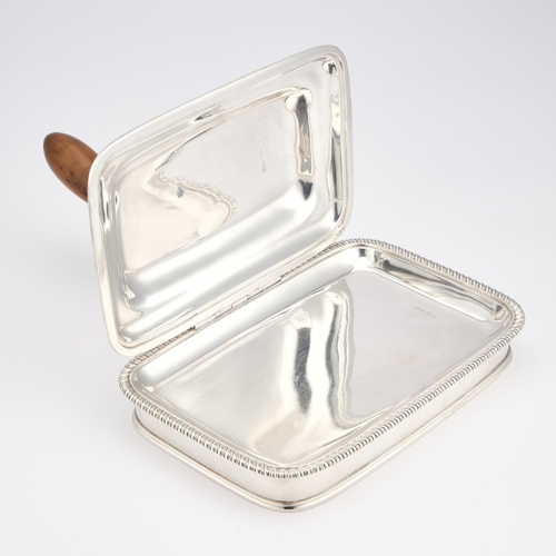 488 - A GEORGE III SILVER CHEESE WARMING DISH by Thomas Robins, London 1812, of rounded rectangular form, ... 