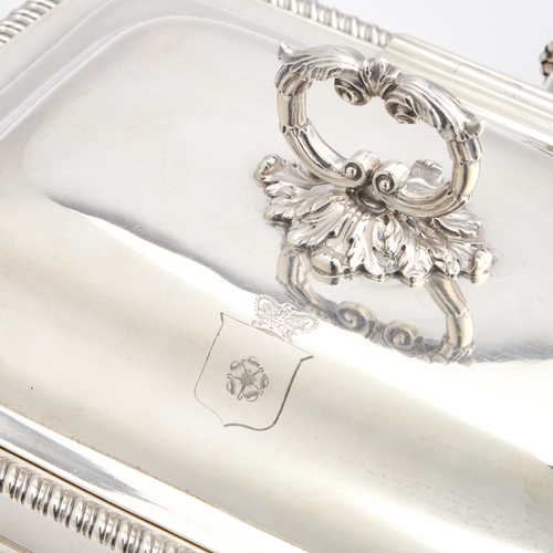 488 - A GEORGE III SILVER CHEESE WARMING DISH by Thomas Robins, London 1812, of rounded rectangular form, ... 