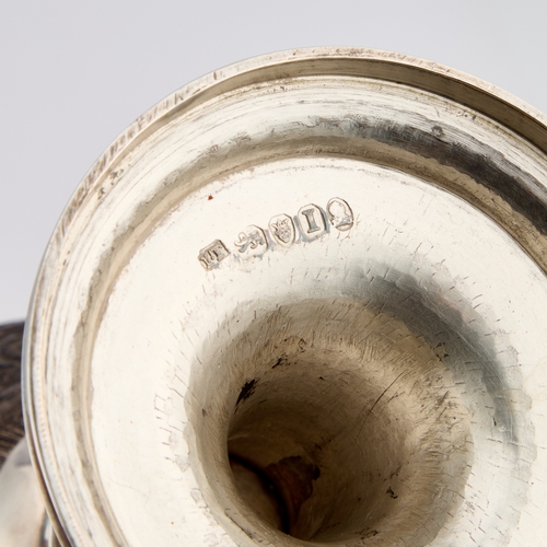 505 - A PAIR OF GEORGE III SILVER-MOUNTED COCONUT CUPS maker I.T?, London 1804, each intricately carved wi... 