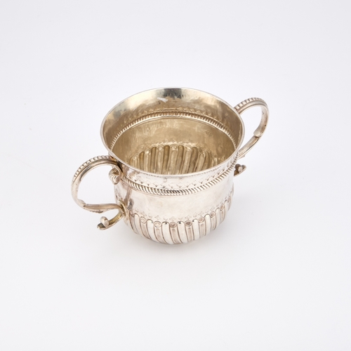 522 - A QUEEN ANNE BRITANNIA STANDARD SILVER PORRINGER maker's mark indistinct, London 1704, of classic fo... 