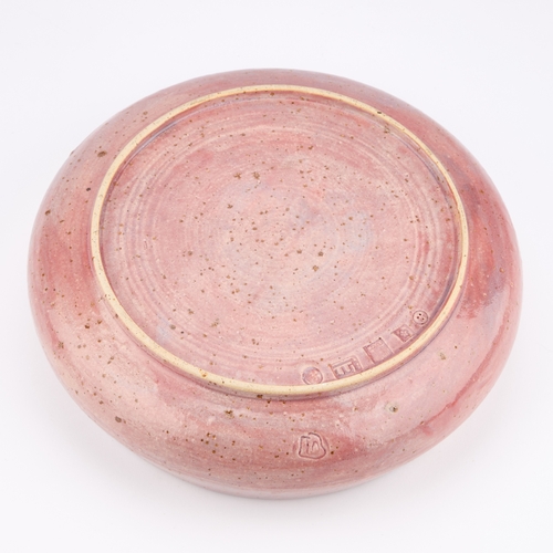 53 - AN INTERESTING STUDIO POTTERY BOWL of circular form with rounded sides, the exterior covered in a va... 