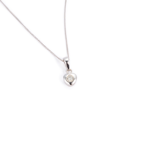 614 - A DIAMOND PENDANT ON CHAIN a round brilliant-cut diamond within a heart setting, unmarked. Estimated... 